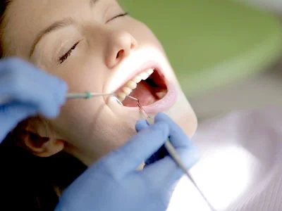 Dental professional discussing implant treatment
