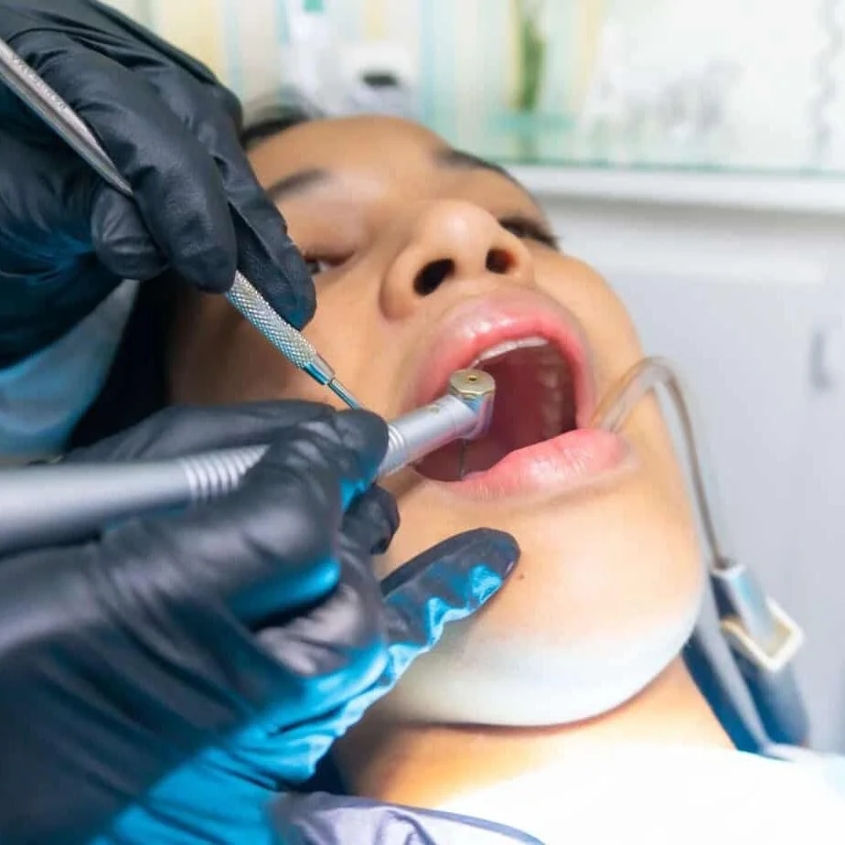 Dental professional providing extraction-related care